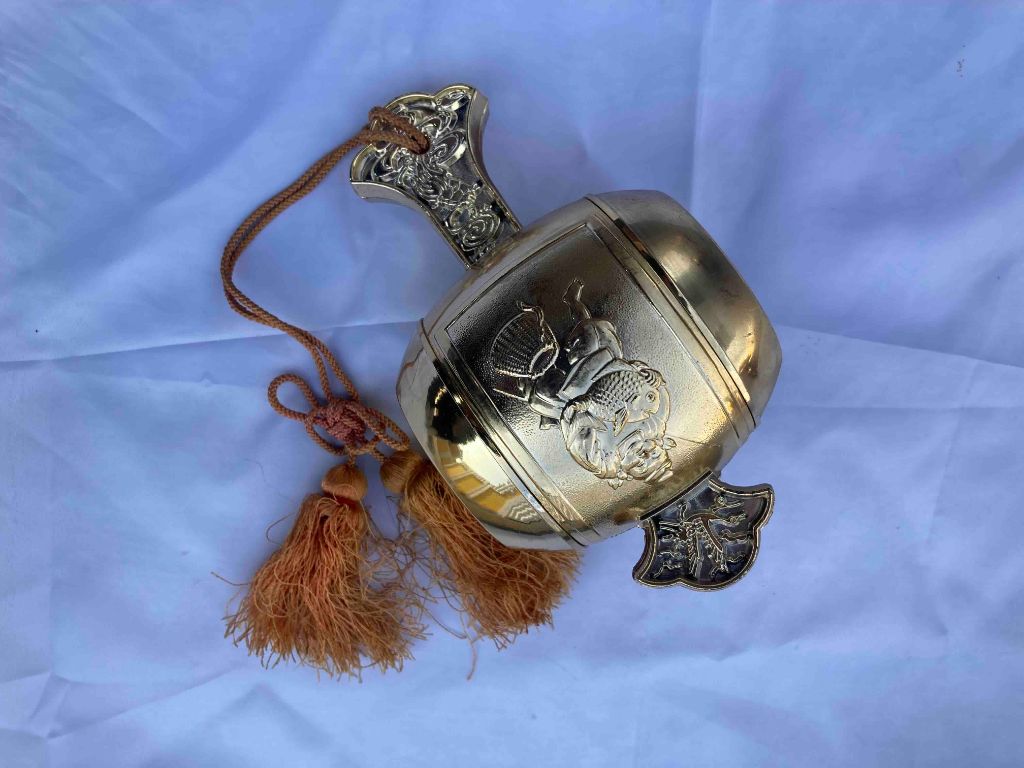 Ornamental bell with tassels