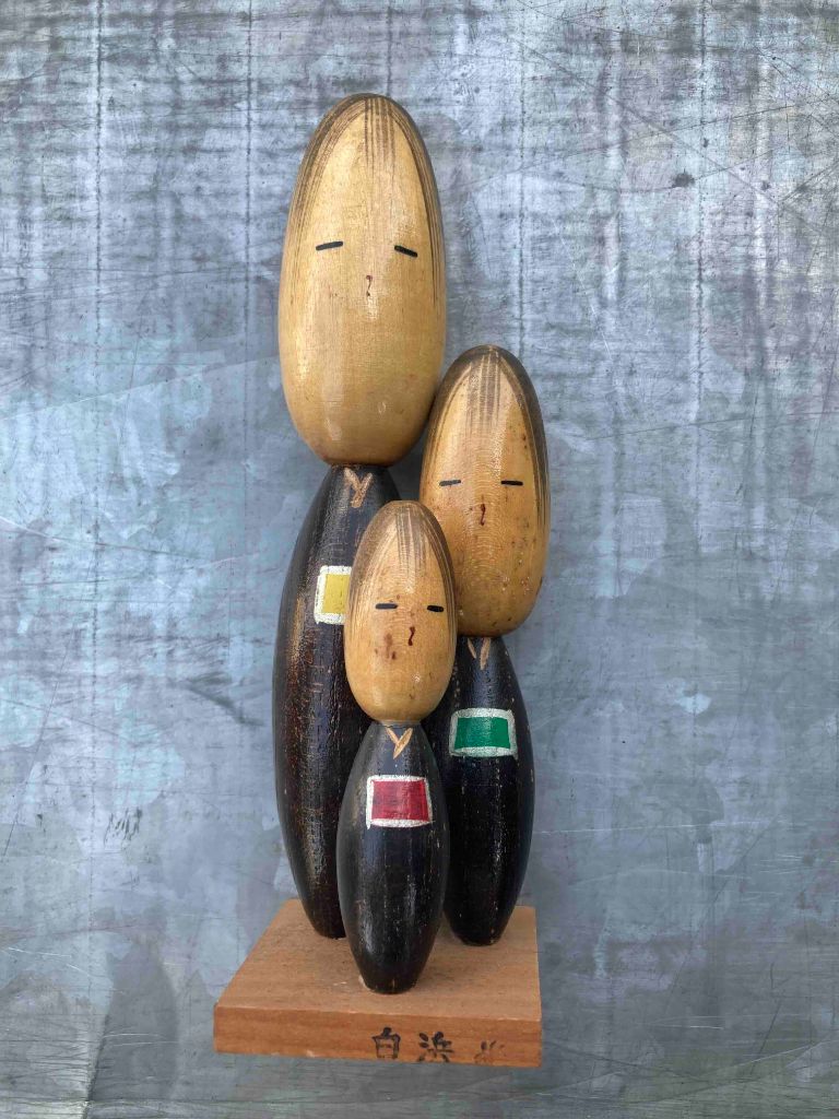 Wooden family sculpture